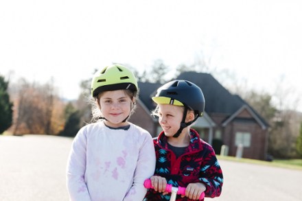 two girls wearing best kids bike helmets