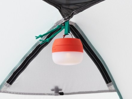 REI Co-op Arete ASL 2 Tent Light (sold separately) hung on gear loop (Kabocha Orange)