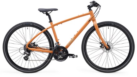 Orange Co-op Cycles CTY 1.1 hybrid bike with disc brakes.